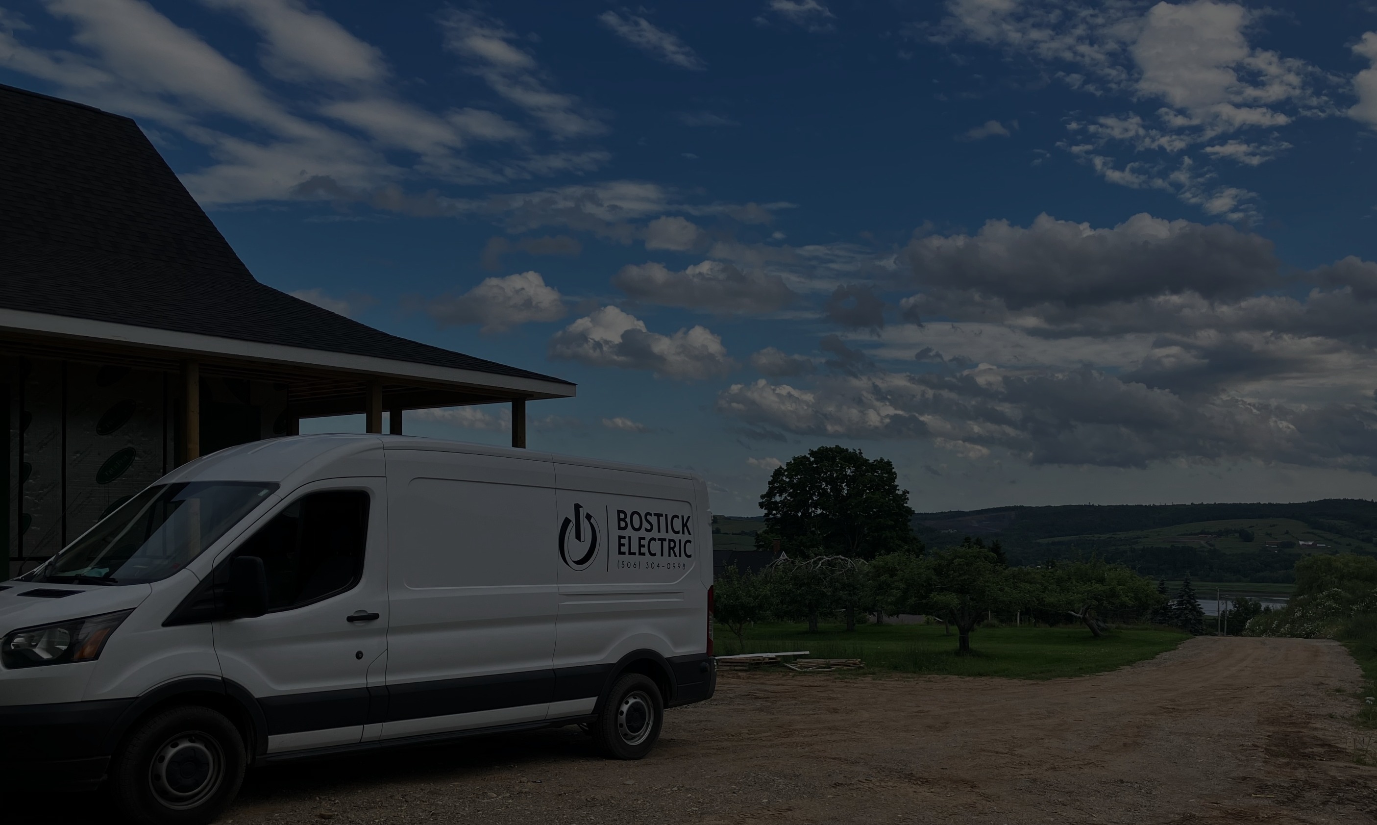 A Bostick Electric van parked above the Saint John River near Fredericton, NB